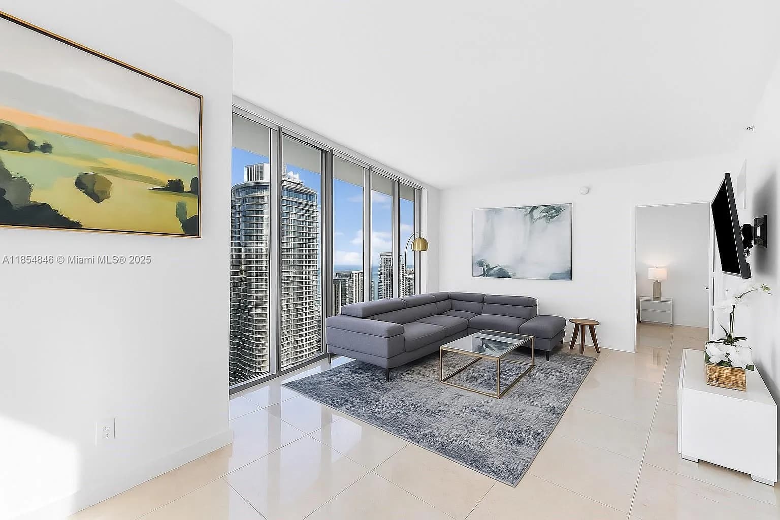 Sophisticated lounge area with polished floors and stylish art pieces.