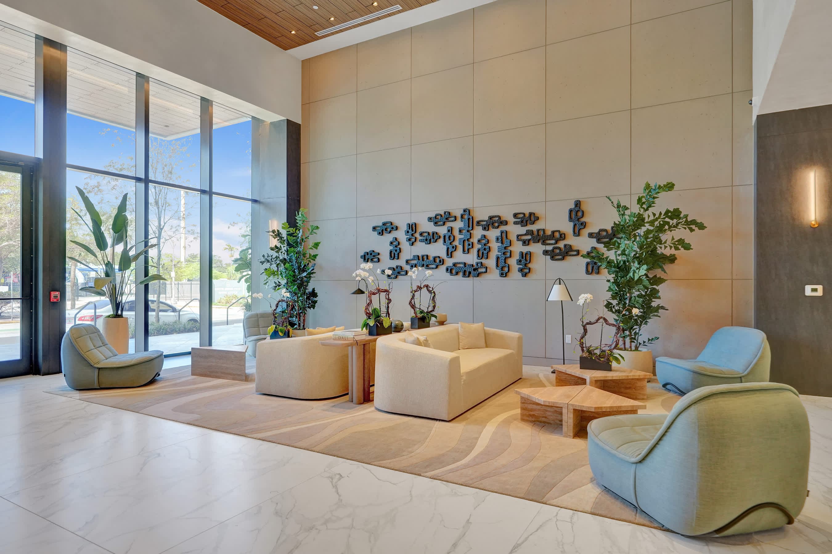 Lobby seating beneath a tall wood ceiling.