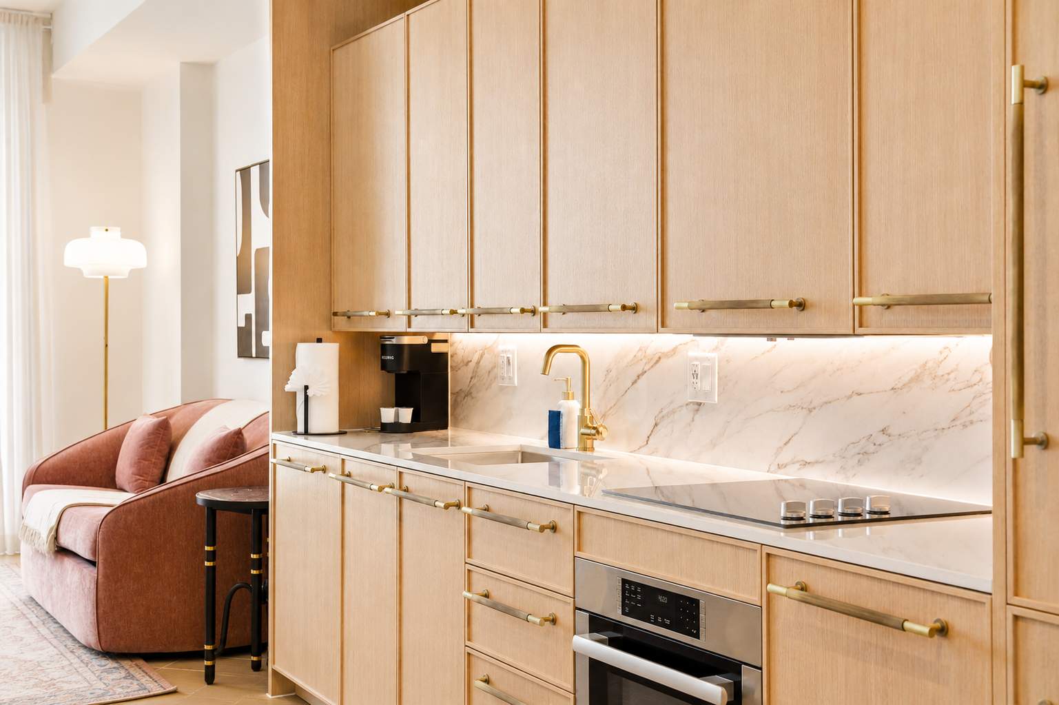 Kitchen with pale wood cabinets.