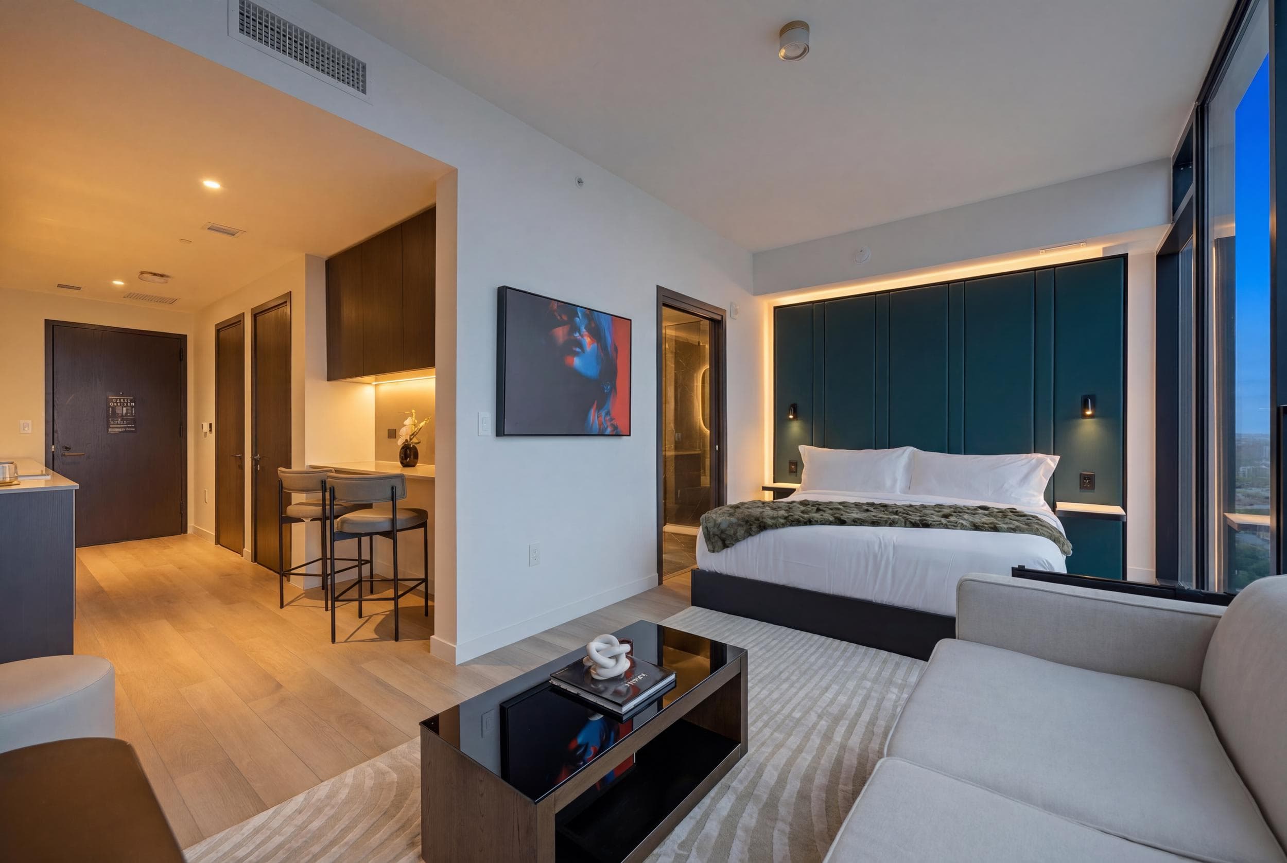 Studio bedroom with a sofa and coffee table.