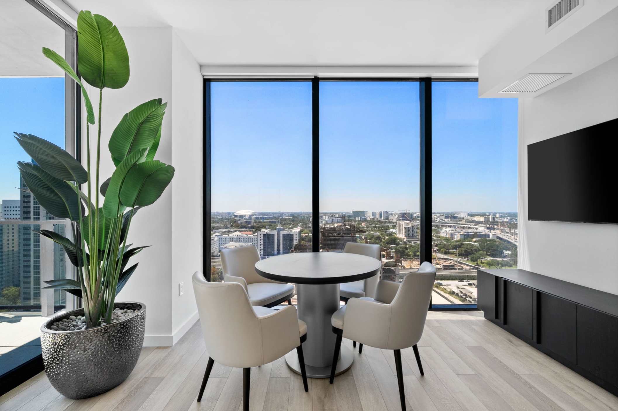 Dining table with chairs beside the living area.