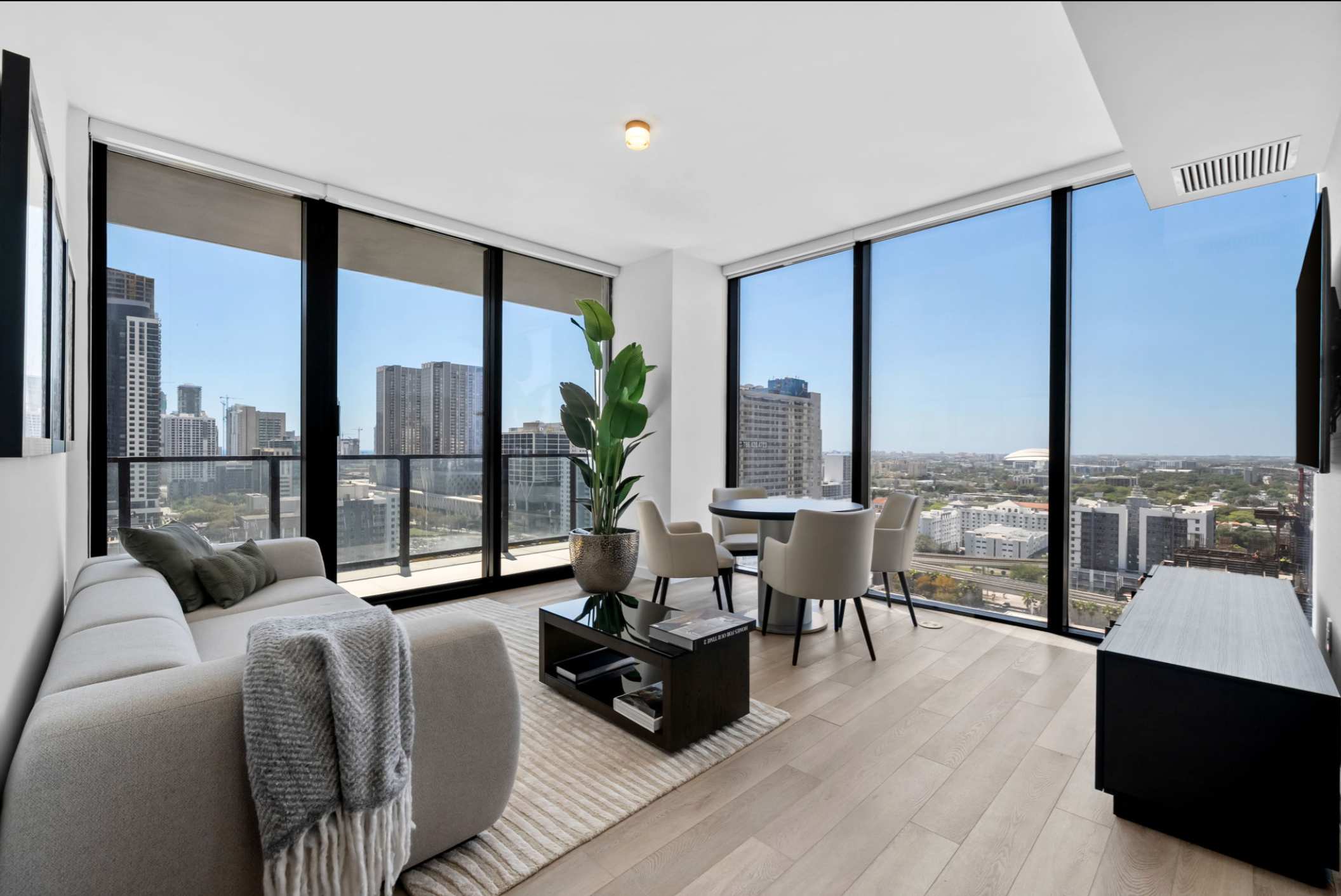 Living area with a sofa and television.