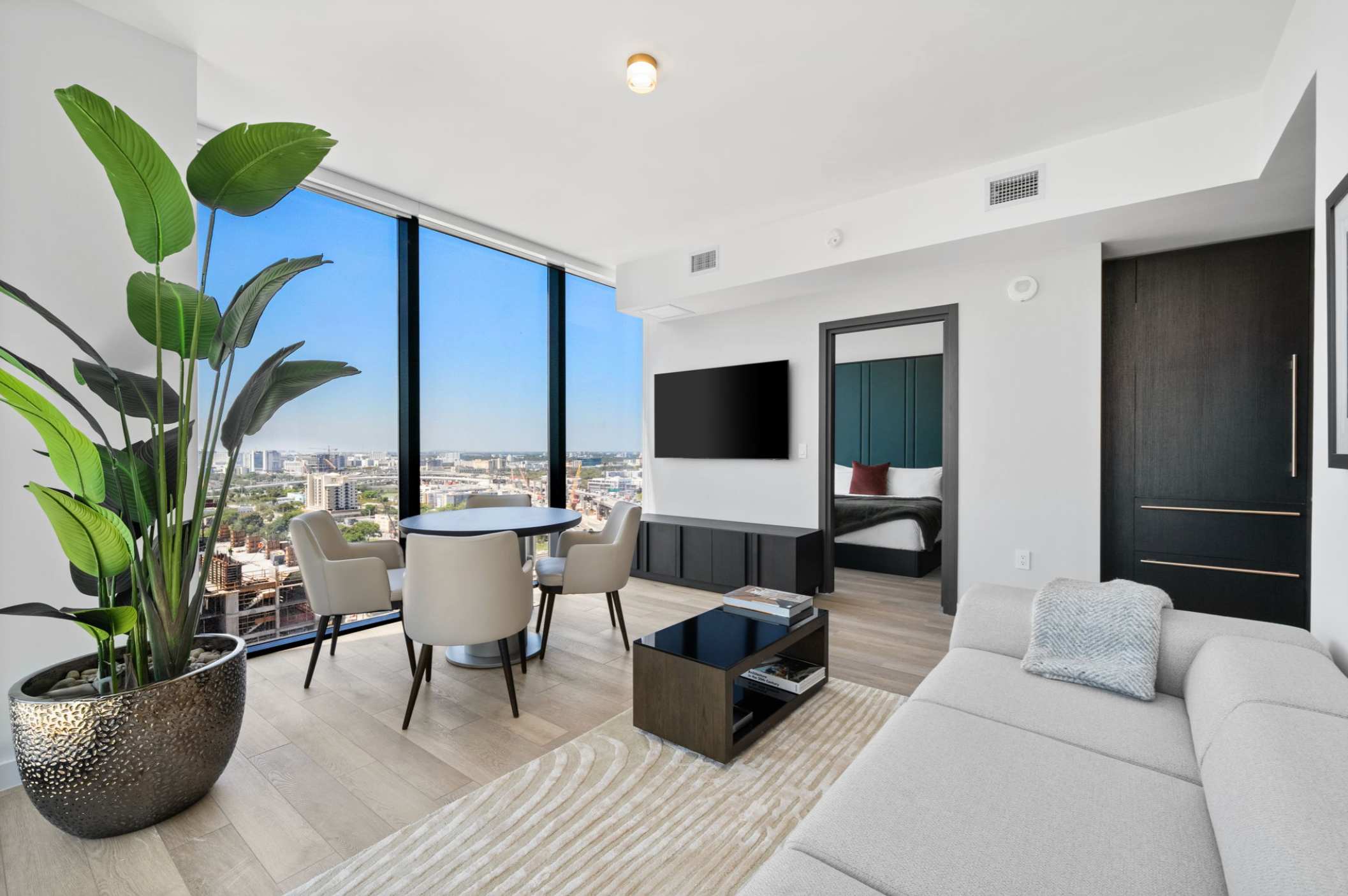 Living area with a sofa and television.
