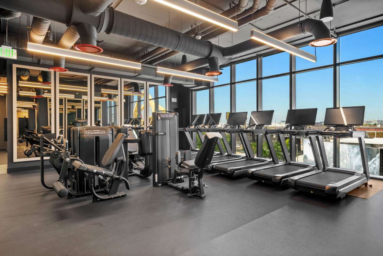 Gym with treadmills and exercise bikes.