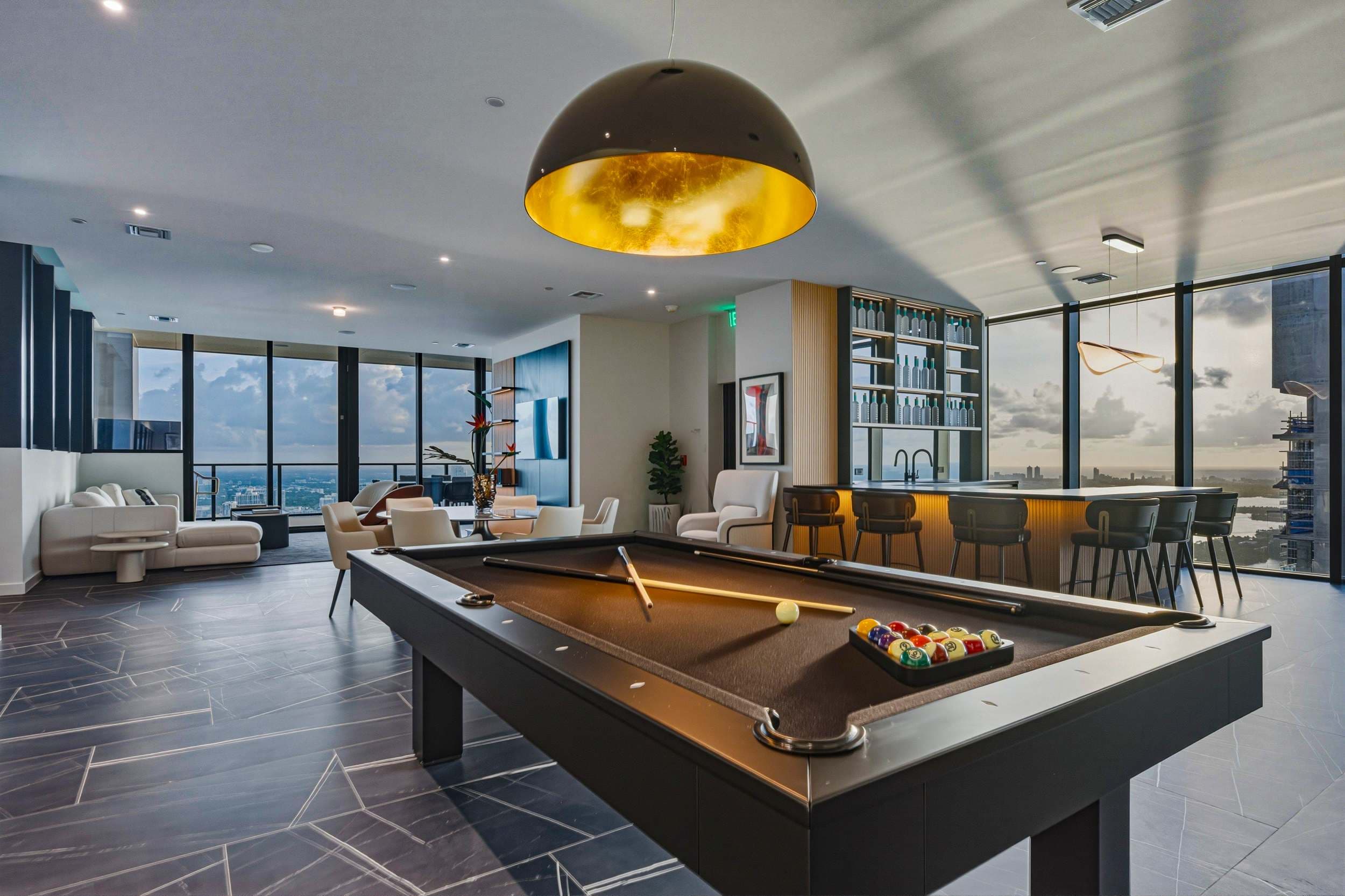 Billiards table beside the home bar.