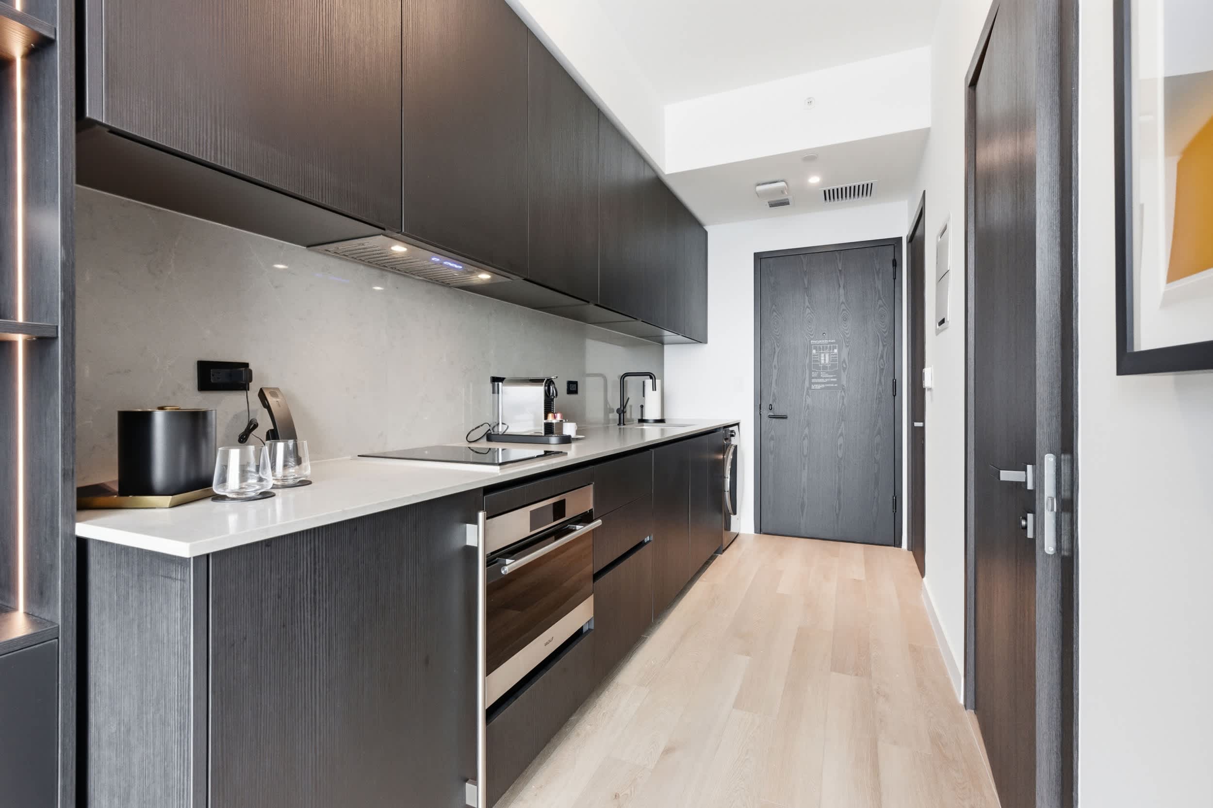 Kitchen counter beside the apartment entrance.
