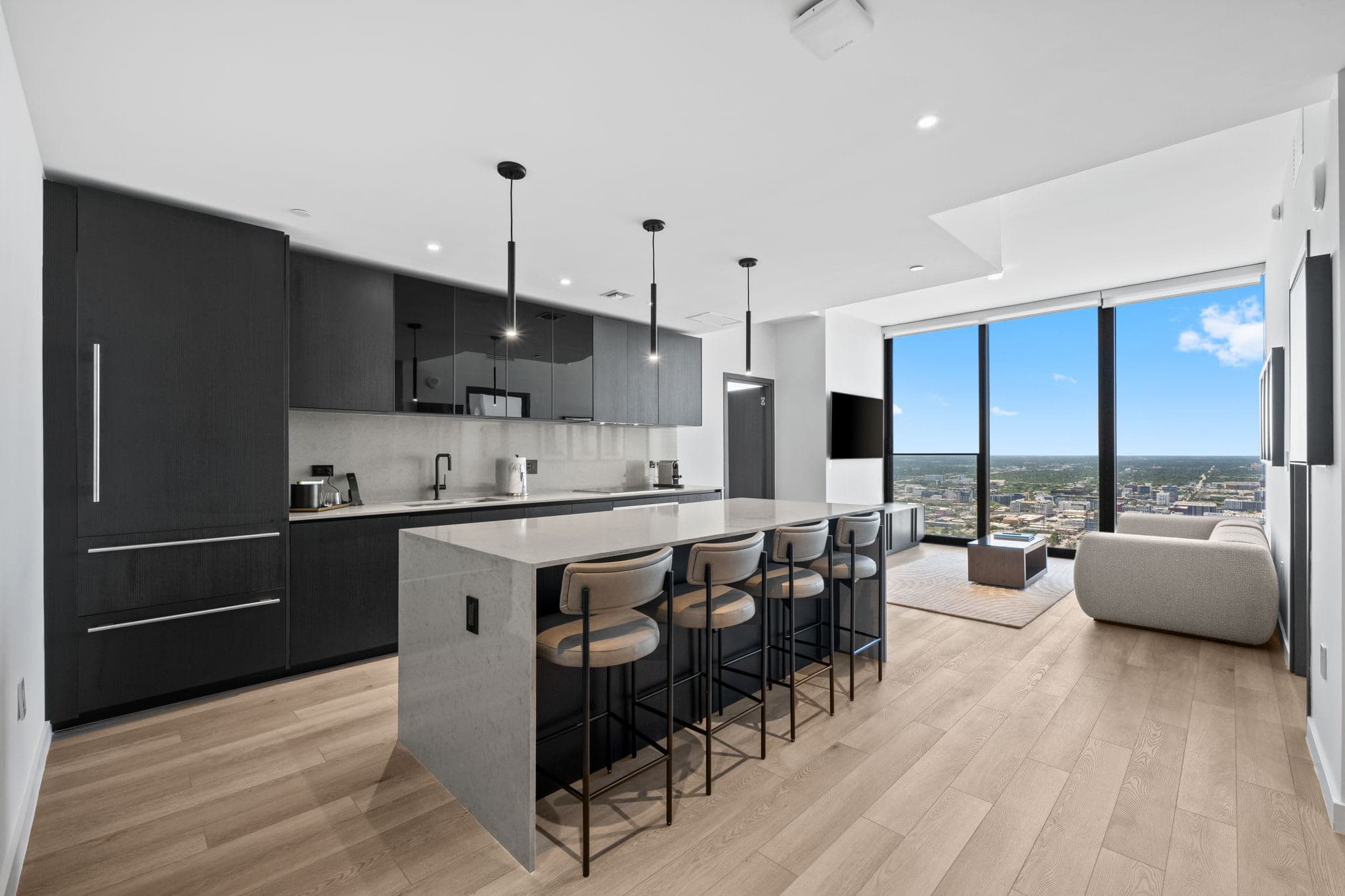 Kitchen island with upholstered bar stools.