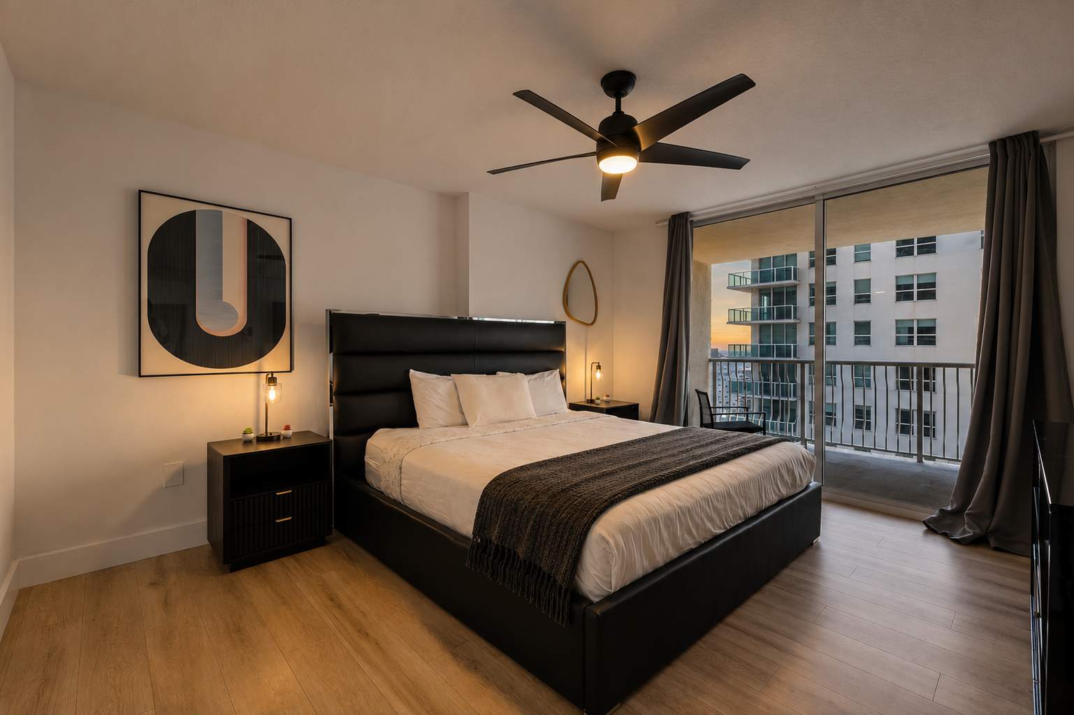 Bedroom with dark furniture and a ceiling fan.