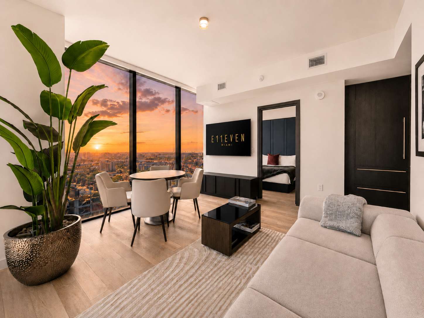 Living room overlooking the city at sunset.