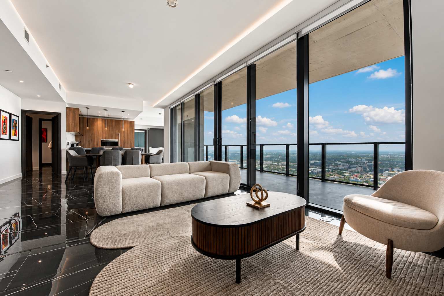 Living room with sofas and floor-to-ceiling windows.