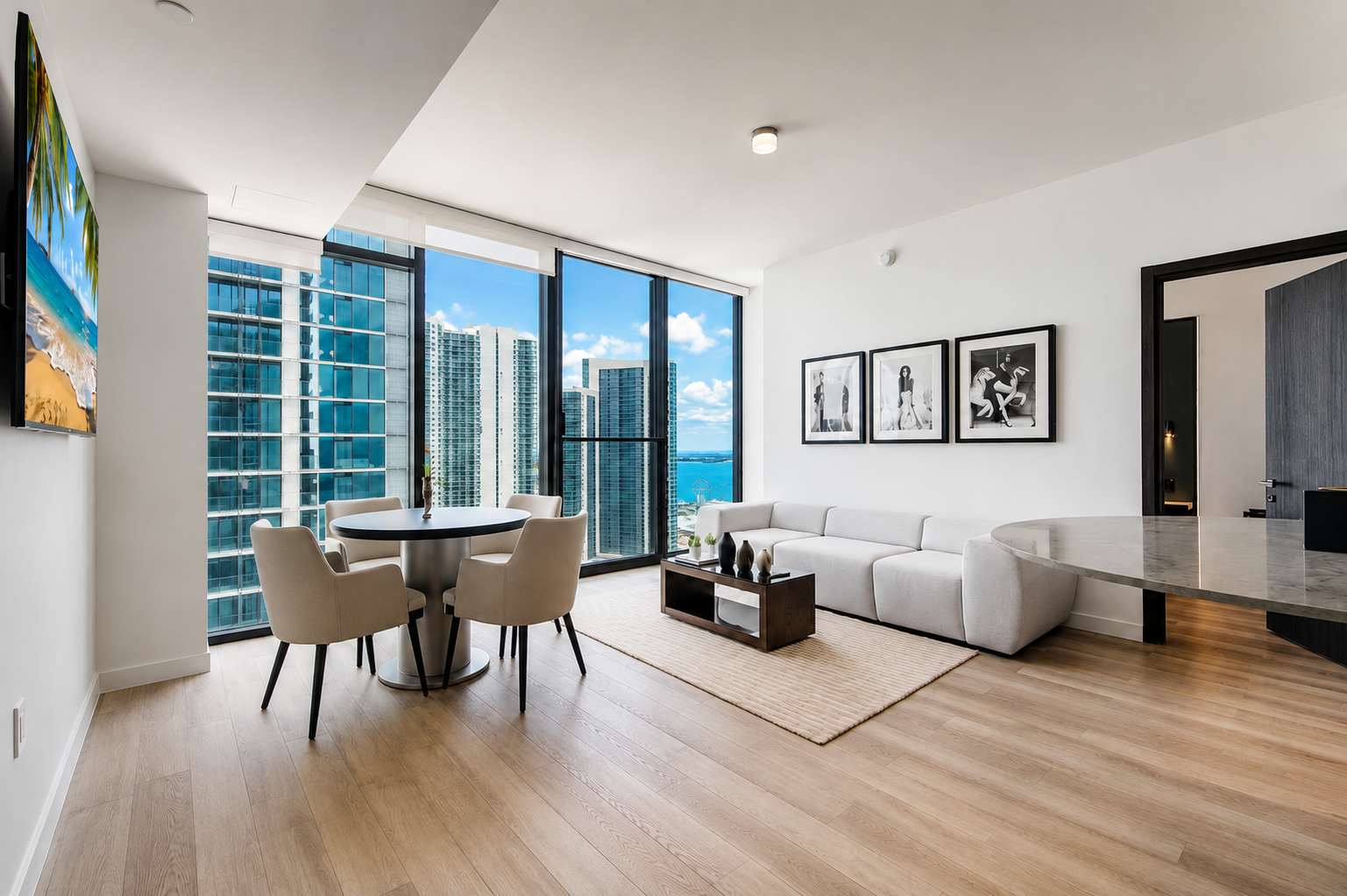 Living room with a sofa and city-view windows.