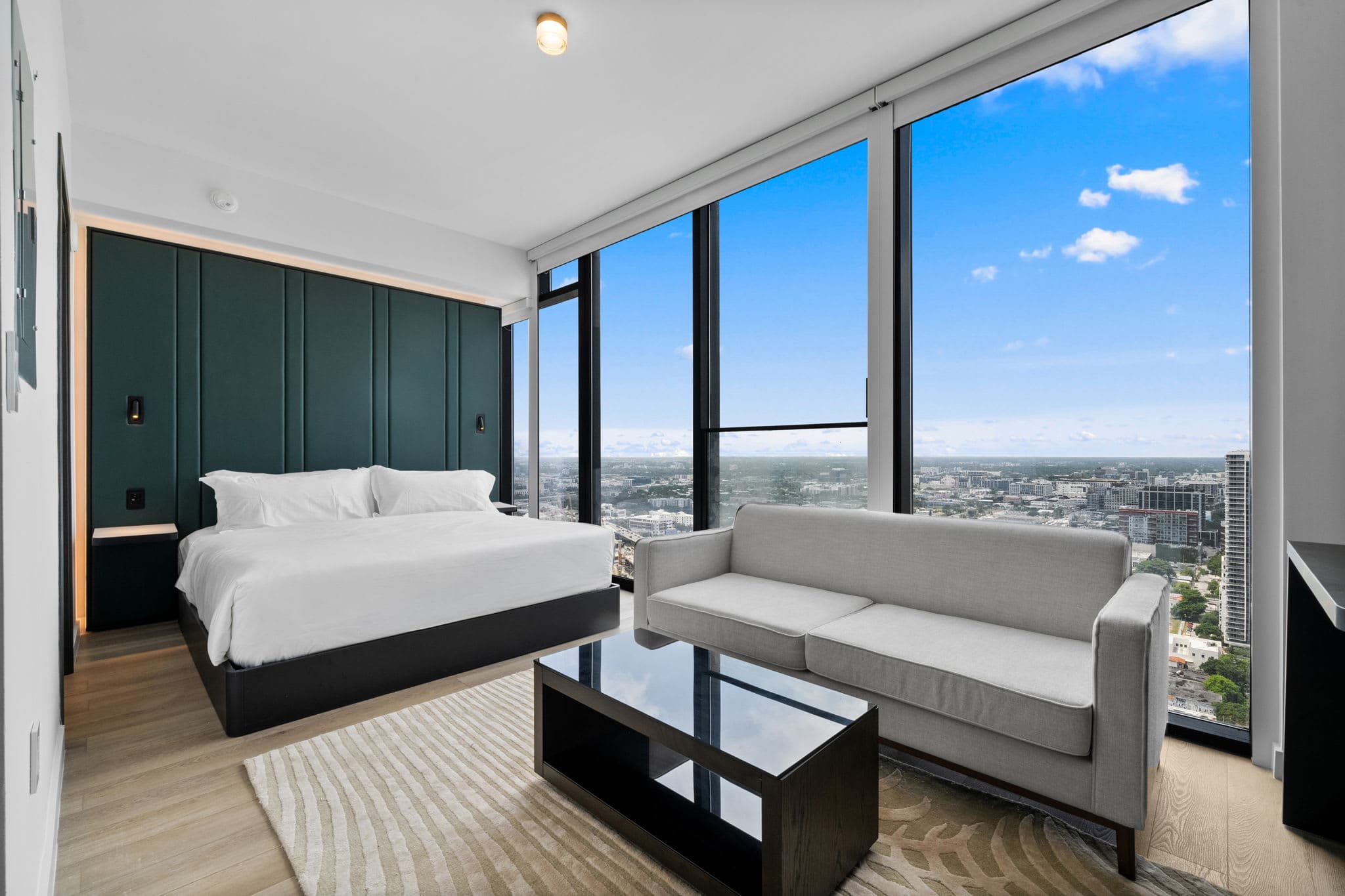 Studio bedroom with a sofa and coffee table.