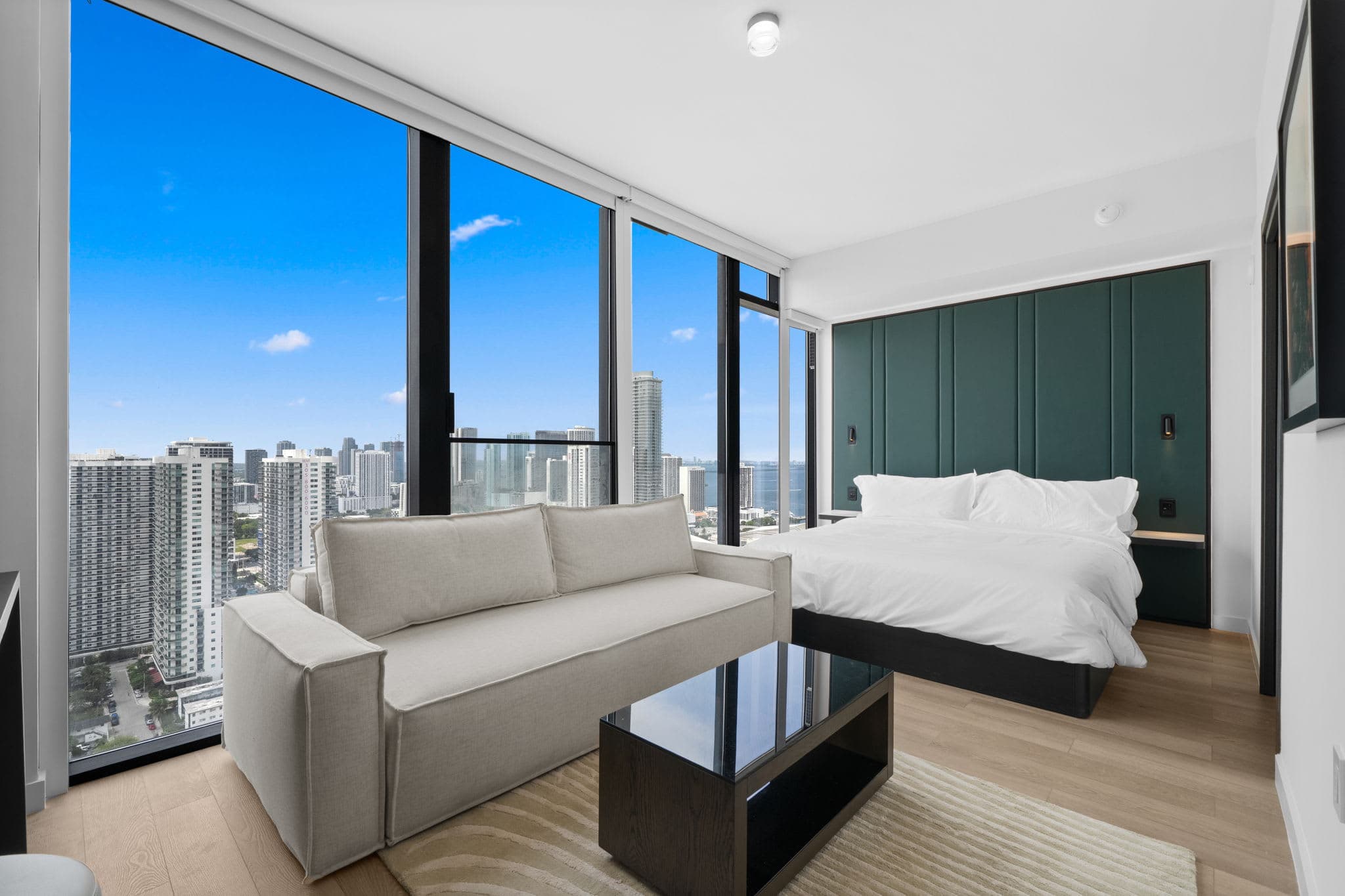 Studio bedroom with a sofa and coffee table.