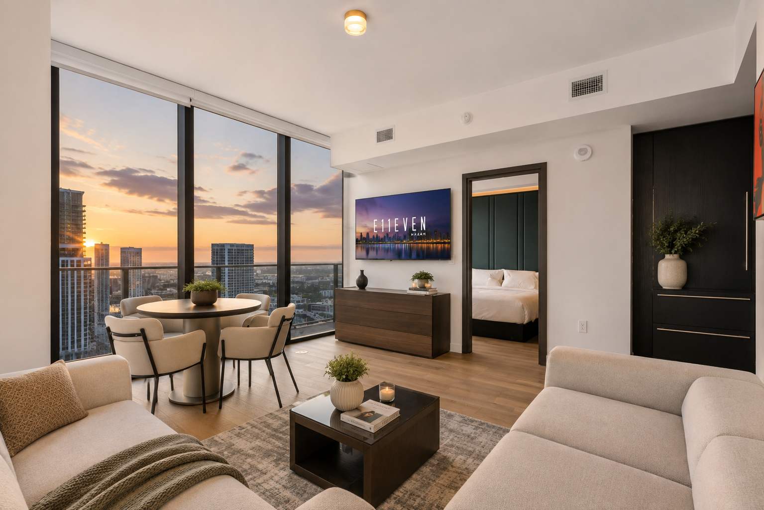 Living and dining area beside sunset views.