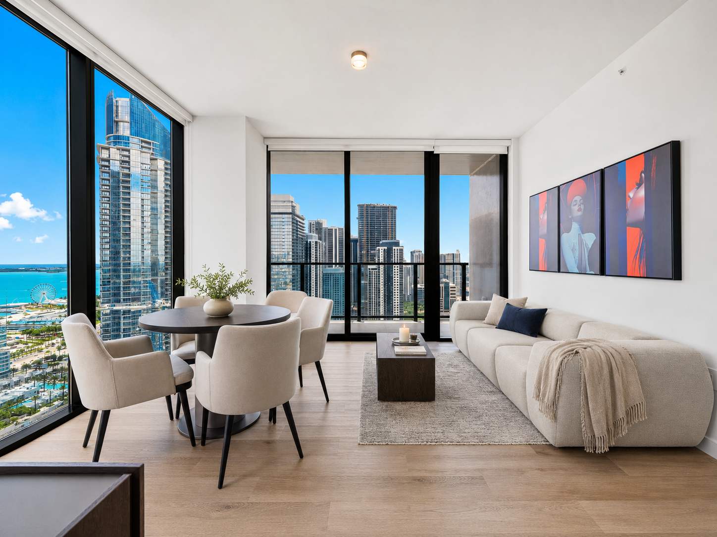 Living room with a sofa and city-view windows.