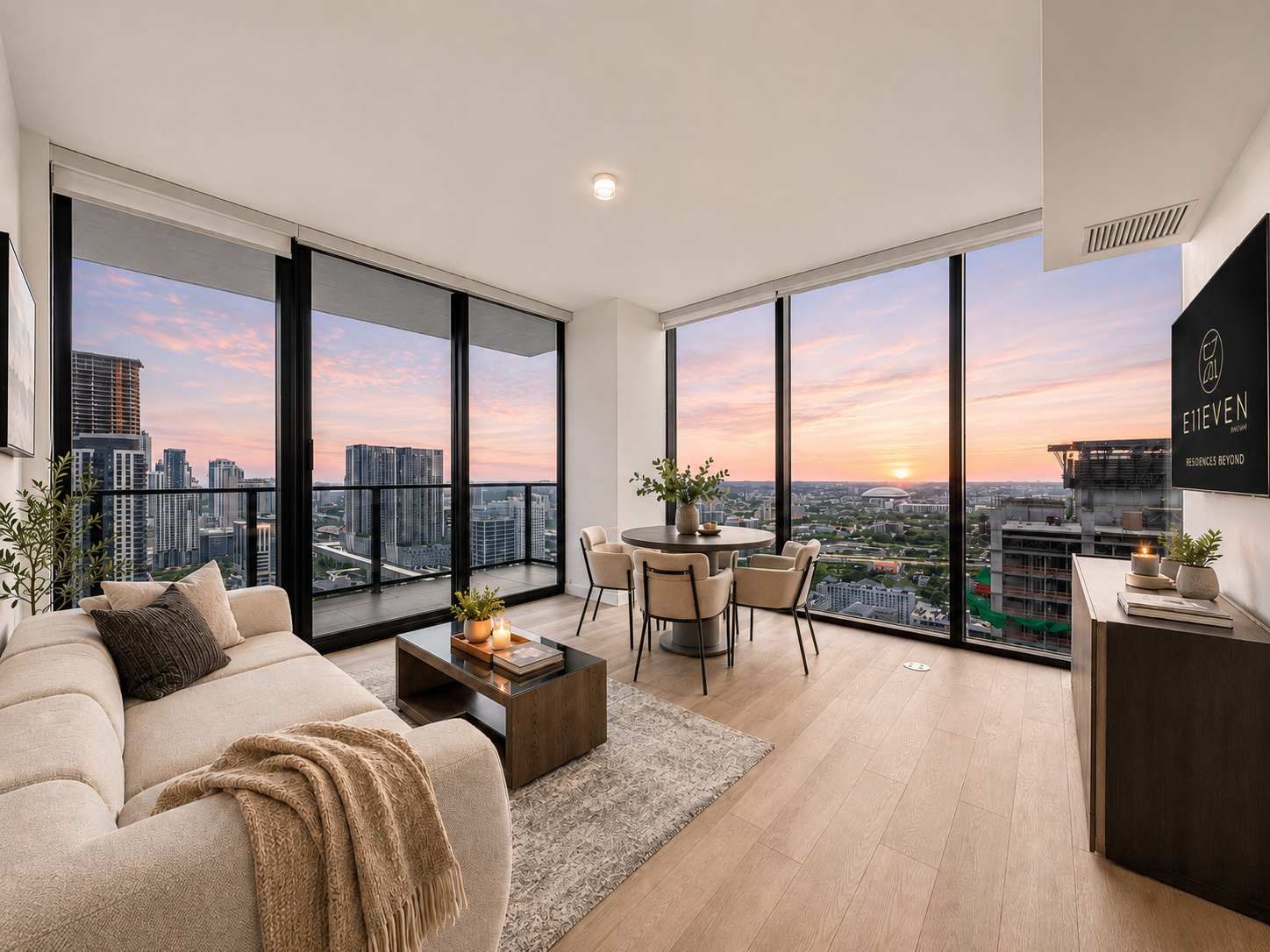 Living room overlooking the city at sunset.