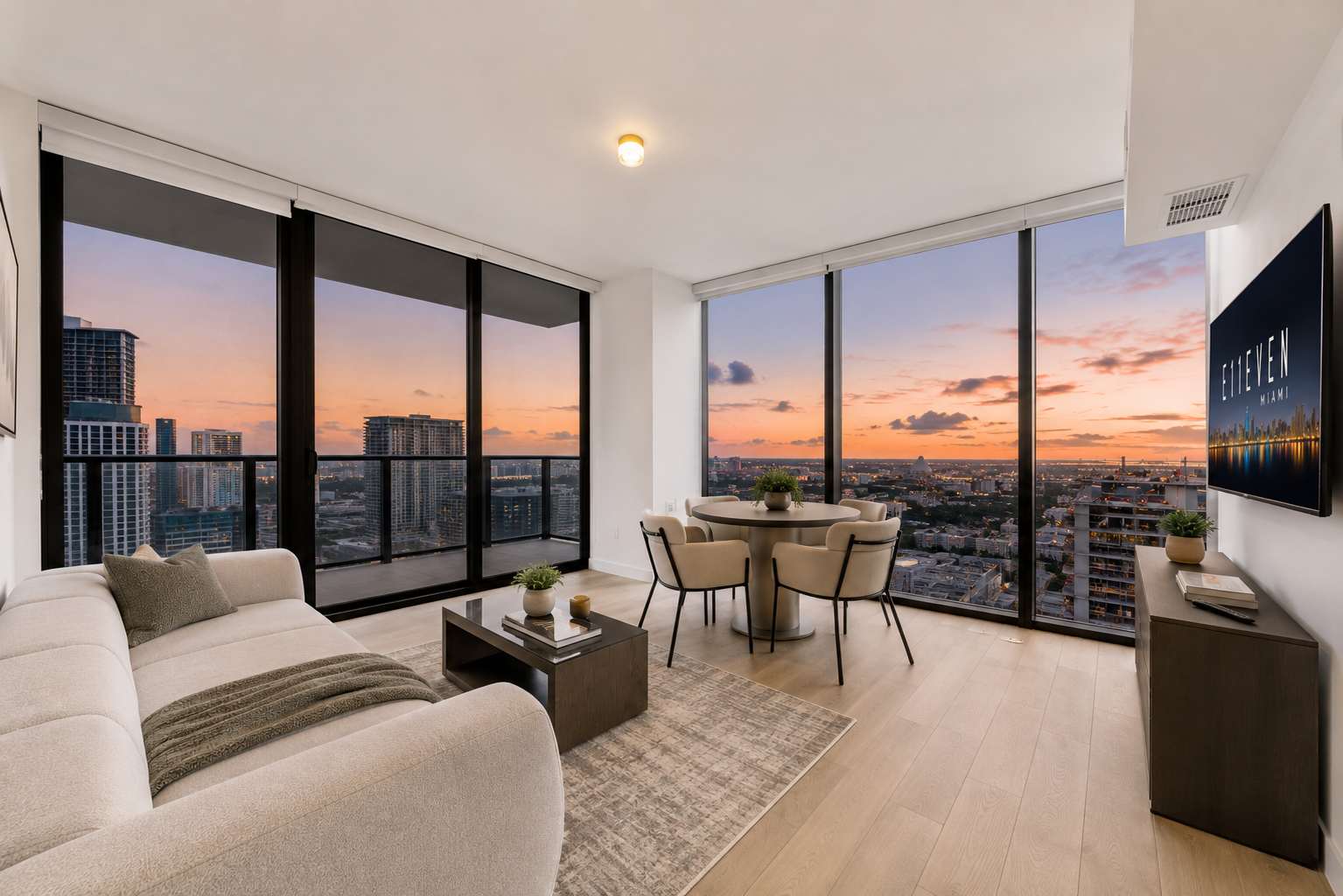 Living room overlooking the city at sunset.