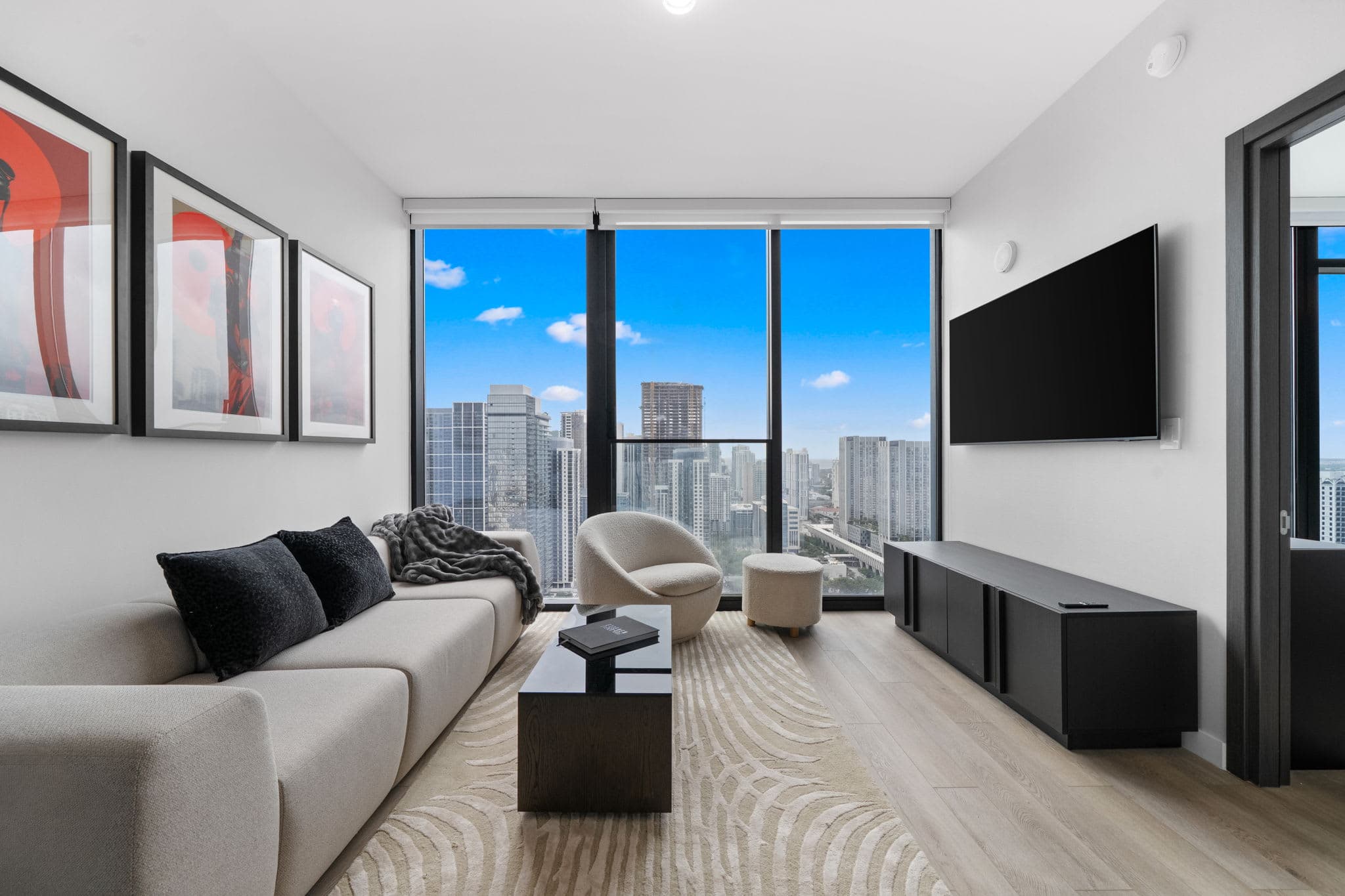 Living area with a sofa and television.
