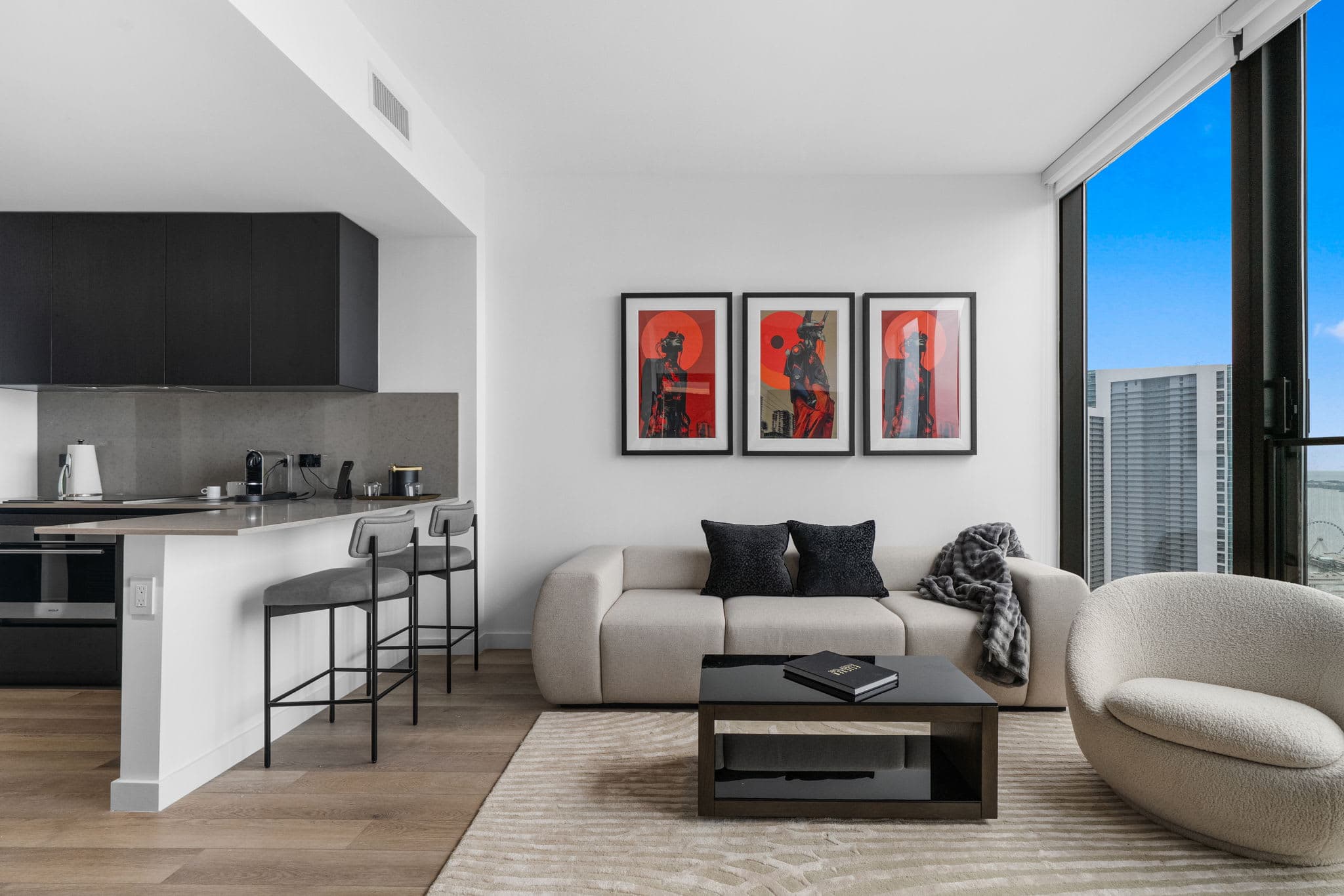 Living area with a sofa and television.