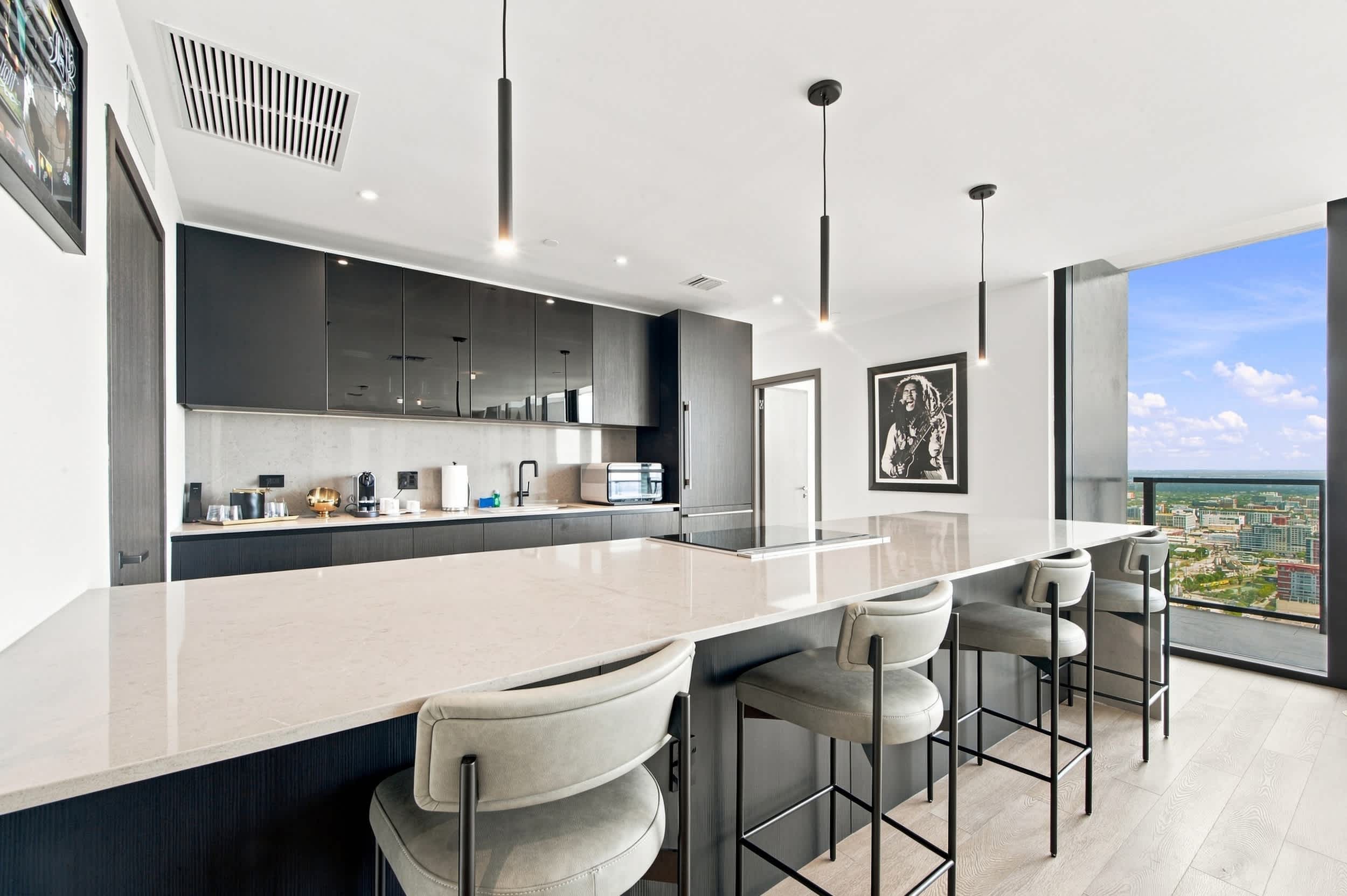 Kitchen island with upholstered bar stools.