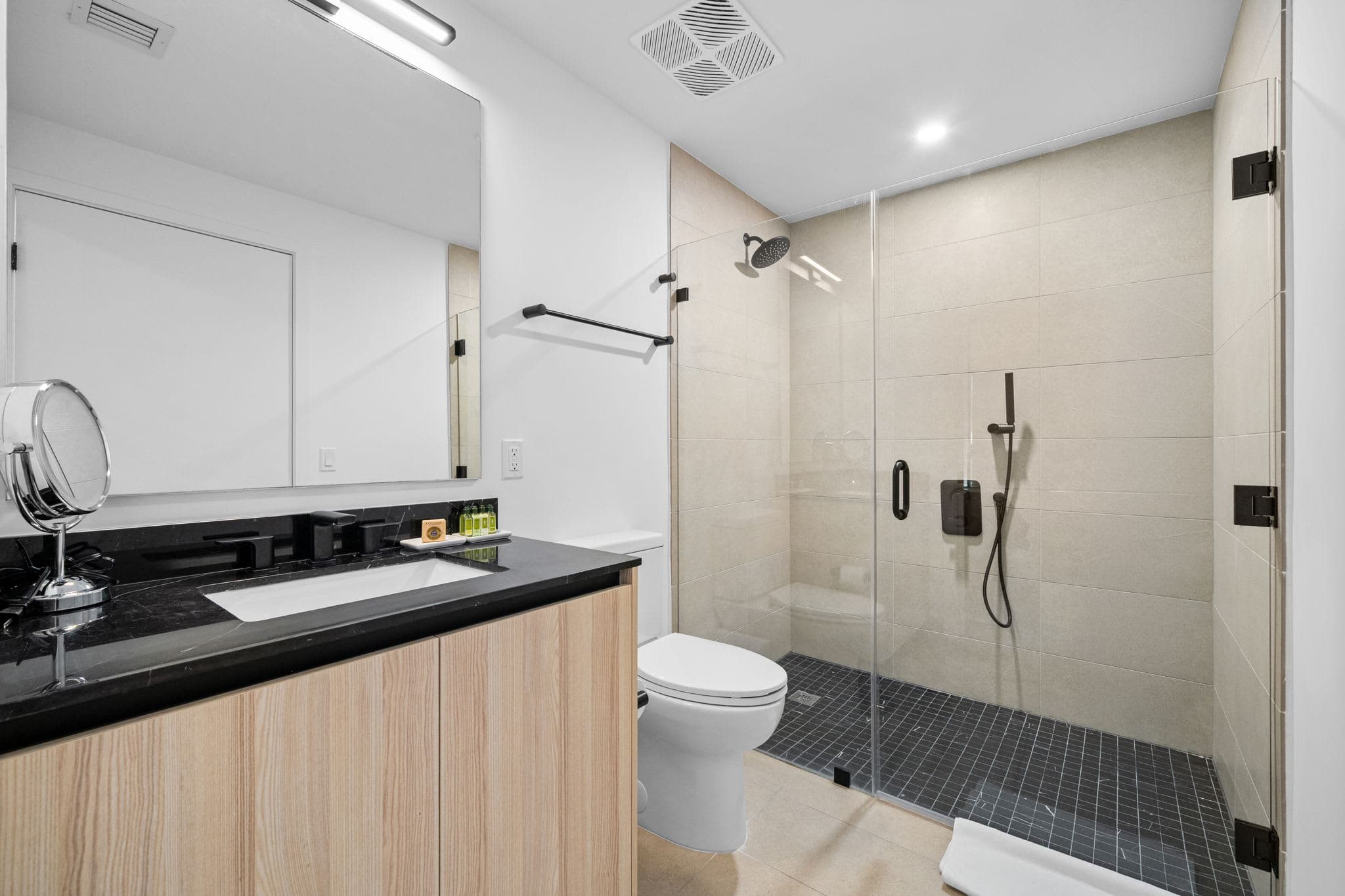 Bathroom with a glass-enclosed shower.