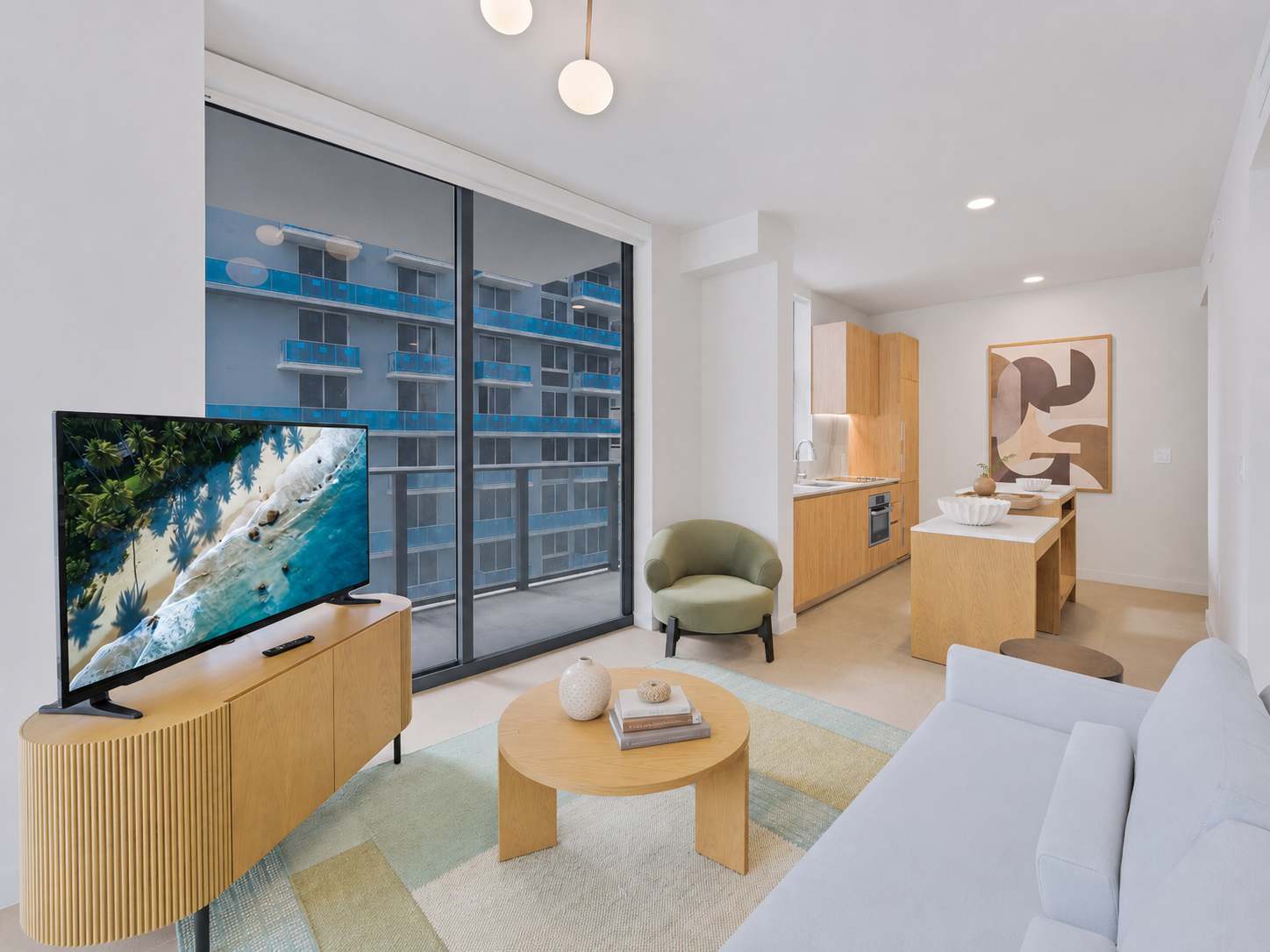 Living area with a sofa and television.