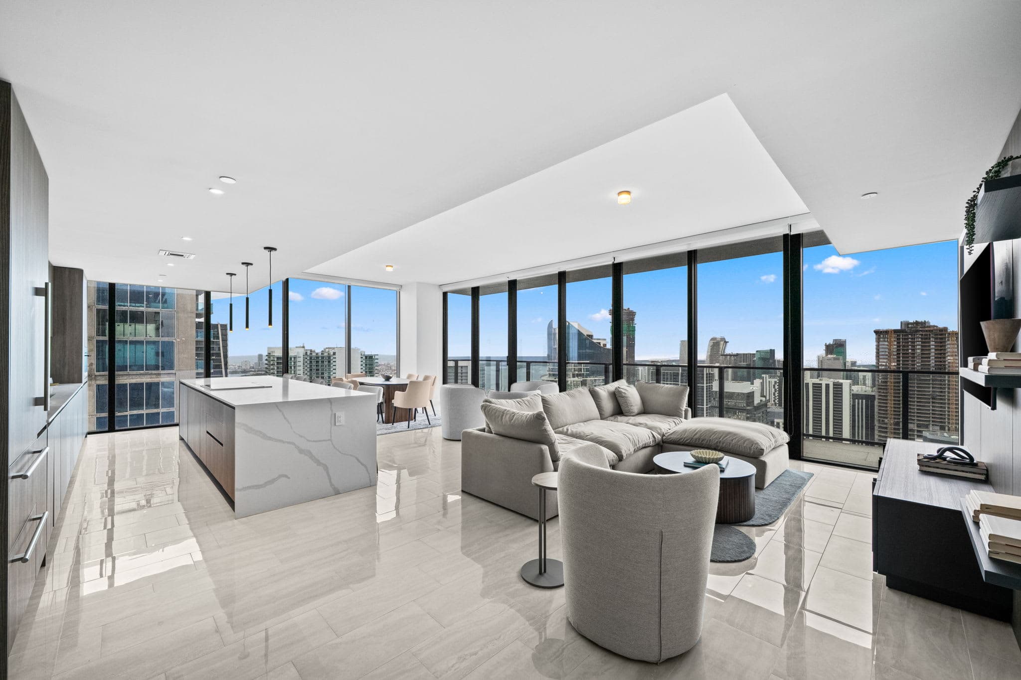 Open living area beside a large kitchen island.