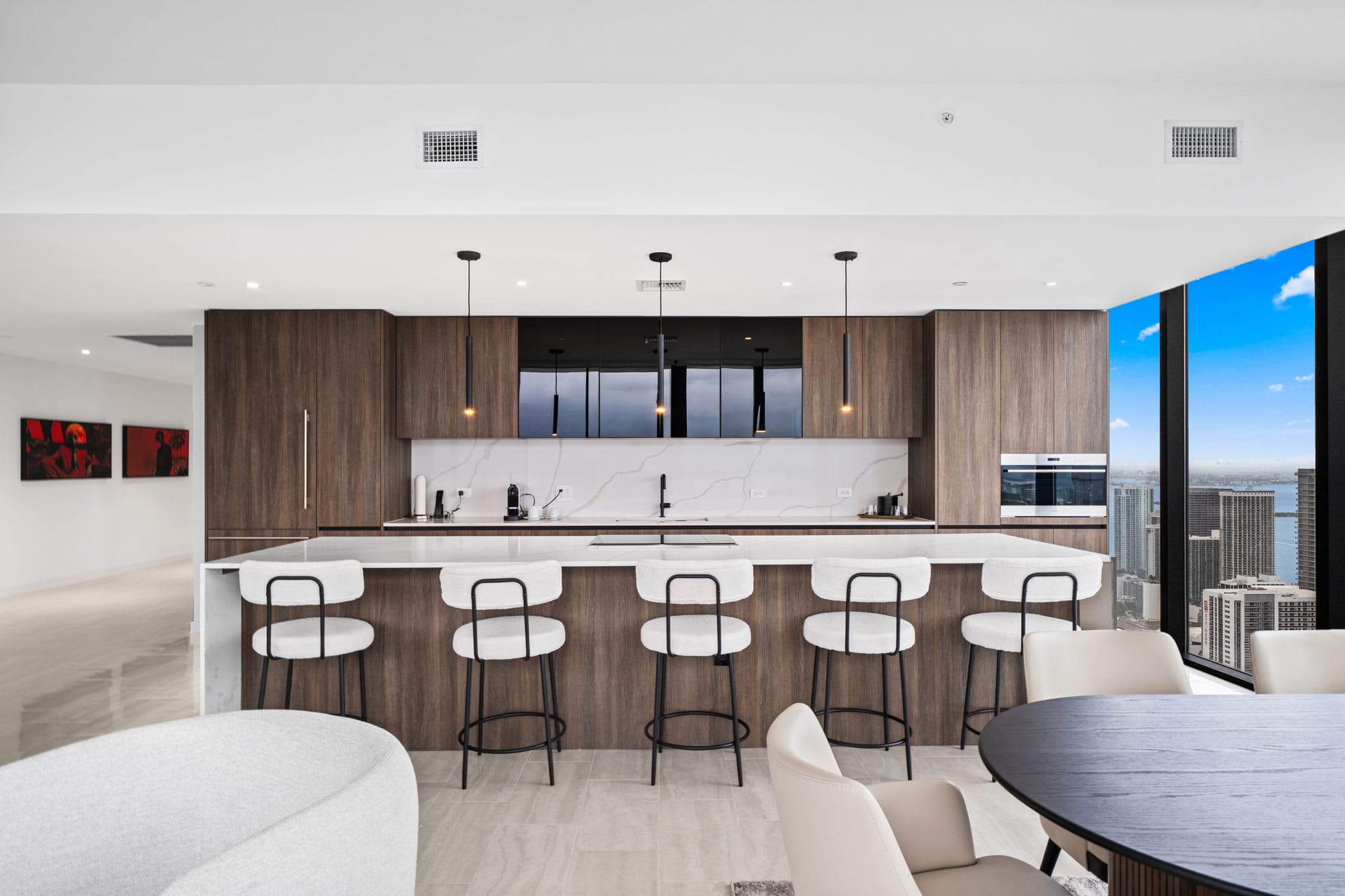 Kitchen breakfast bar with four stools.