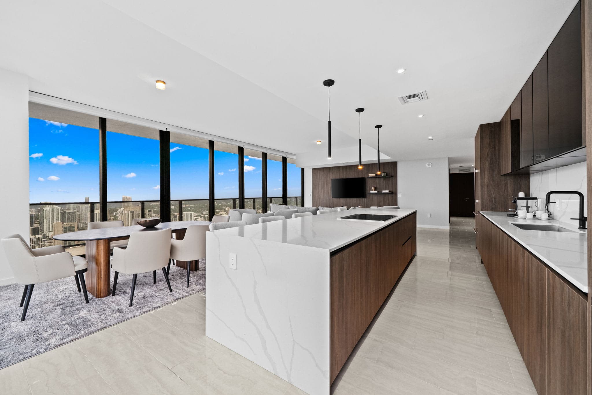 Kitchen with a stone island and wood cabinetry.